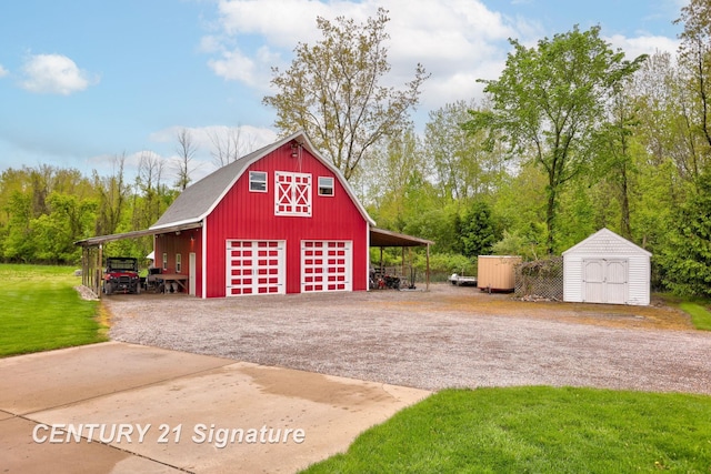 12751 Wilkinson Rd, Freeland, MI 48623 - garage featuring a detached garage, dirt driveway, and a shed