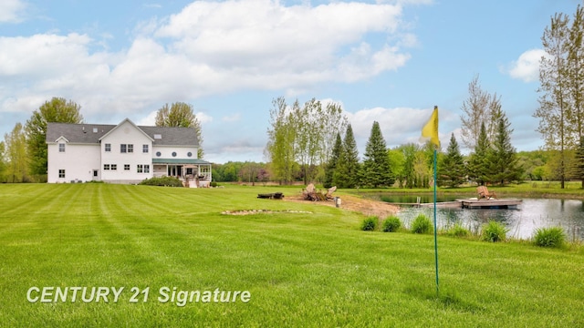 12751 Wilkinson Rd, Freeland, MI 48623 - view of green lawn featuring a water view and a floating dock