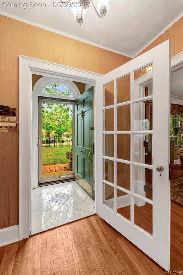 2918 Burns St, Detroit, MI 48214 - doorway with wood finished floors and crown molding
