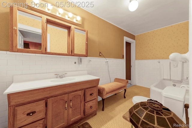 2918 Burns St, Detroit, MI 48214 - full bathroom with wainscoting, vanity, tile walls, ornamental molding, and tile patterned floors
