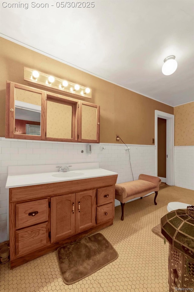 2918 Burns St, Detroit, MI 48214 - bathroom with vanity, wainscoting, and tile walls