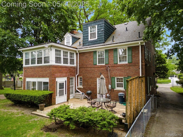 2918 Burns St, Detroit, MI 48214 - back of house featuring a wooden deck and brick siding