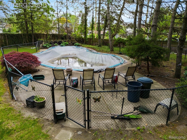 2918 Burns St, Detroit, MI 48214 - view of swimming pool with a fenced backyard and a gate