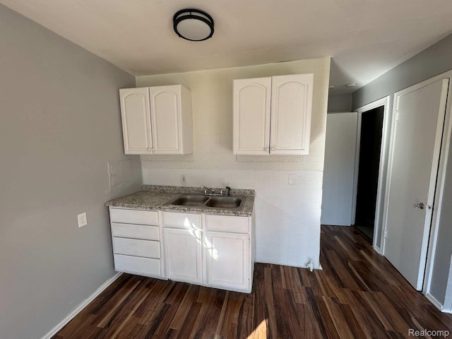 19961 Greenfield Rd, Detroit, MI 48235 - kitchen with a sink, dark wood-style flooring, white cabinets, and light countertops