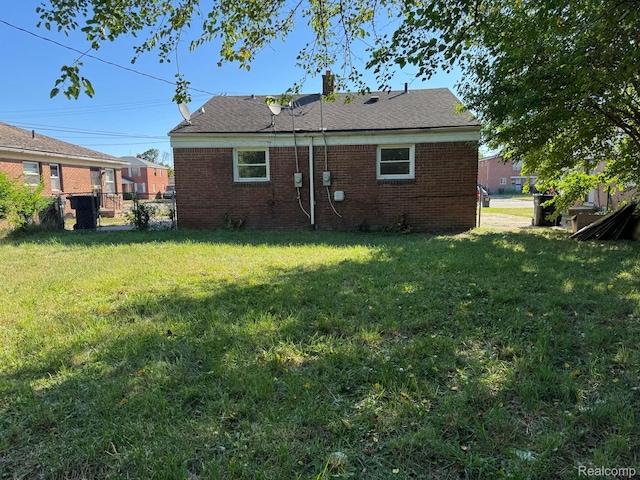 19961 Greenfield Rd, Detroit, MI 48235 - back of house with brick siding and a chimney