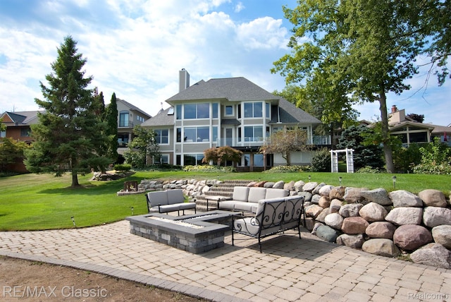 826 Wolverine Dr, Wolverine Lake, MI 48390 - view of patio / terrace featuring an outdoor living space with a fire pit
