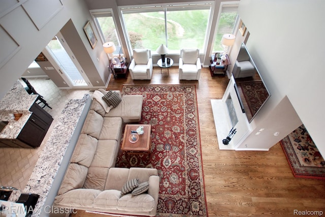 826 Wolverine Dr, Wolverine Lake, MI 48390 - living room featuring wood finished floors and baseboards