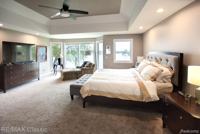 826 Wolverine Dr, Wolverine Lake, MI 48390 - carpeted bedroom with recessed lighting, multiple windows, a raised ceiling, and ceiling fan