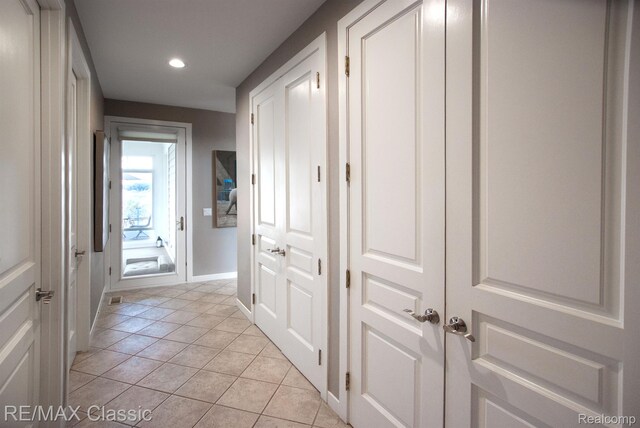826 Wolverine Dr, Wolverine Lake, MI 48390 - hall featuring light tile patterned flooring, recessed lighting, and baseboards