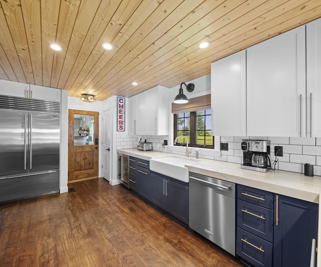 826 Jennie Pl, Monroe, MI 48161 - kitchen with appliances with stainless steel finishes, blue cabinets, a sink, wood ceiling, and wine cooler
