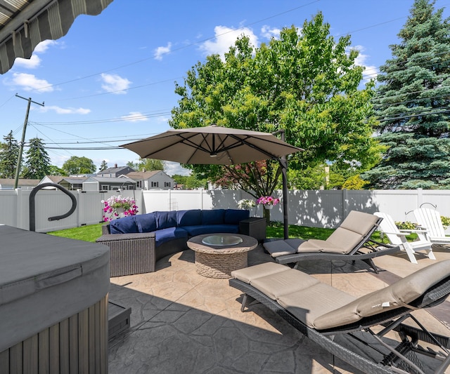 826 Jennie Pl, Monroe, MI 48161 - fenced backyard with a patio area, an outdoor hangout area, and a hot tub