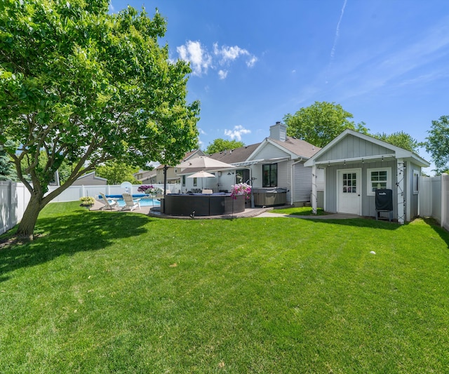 826 Jennie Pl, Monroe, MI 48161 - rear view of house with a hot tub and board and batten siding