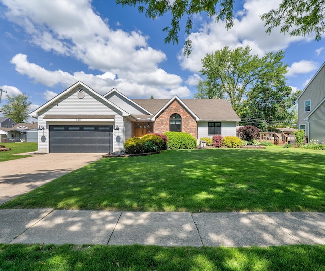 826 Jennie Pl, Monroe, MI 48161 - ranch-style home with a garage, driveway, a front yard, and brick siding