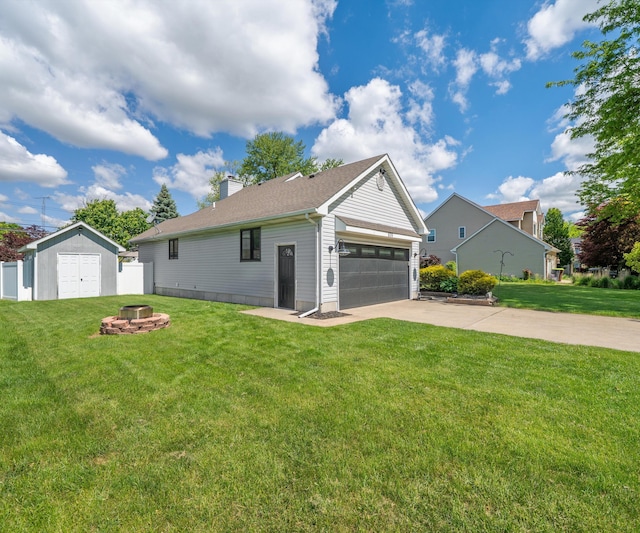 826 Jennie Pl, Monroe, MI 48161 - view of front of home featuring an outdoor fire pit, concrete driveway, a chimney, and a garage
