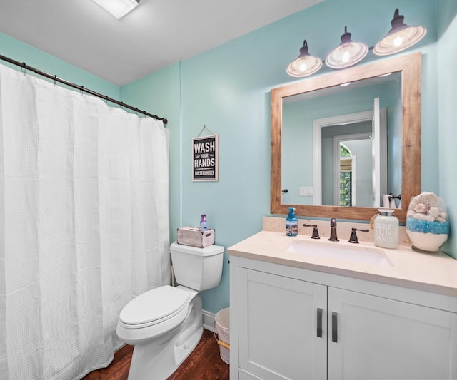 826 Jennie Pl, Monroe, MI 48161 - full bathroom with toilet, vanity, wood finished floors, baseboards, and curtained shower