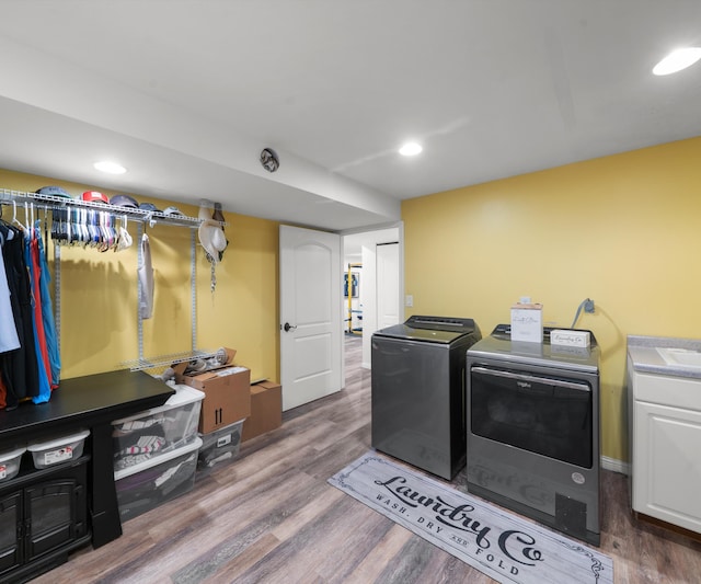 826 Jennie Pl, Monroe, MI 48161 - laundry room featuring separate washer and dryer, cabinet space, wood finished floors, and recessed lighting