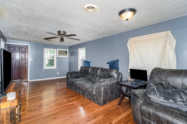 4411 W Michigan Ave, Saginaw, MI 48638 - living room with wood finished floors, ceiling fan, and a textured ceiling