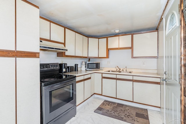 4411 W Michigan Ave, Saginaw, MI 48638 - kitchen with appliances with stainless steel finishes, under cabinet range hood, light marble finish flooring, and light countertops