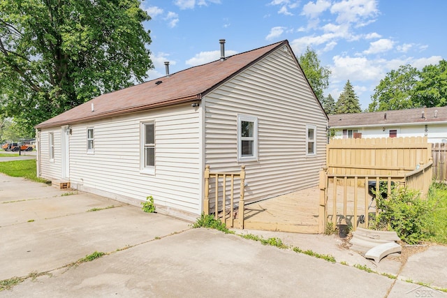4411 W Michigan Ave, Saginaw, MI 48638 - view of side of home with a patio and a shingled roof