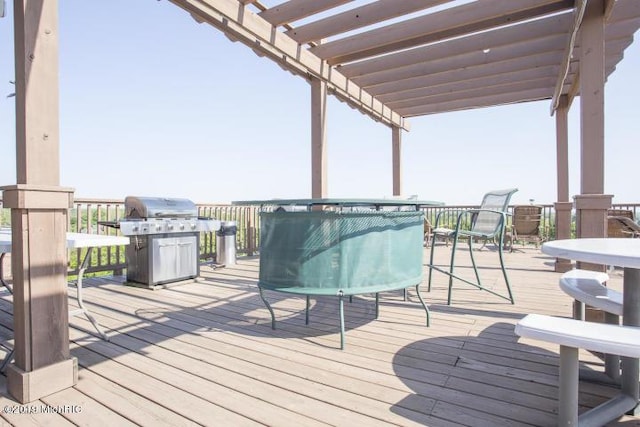 505 Cherry St SE Unit 512, Grand Rapids, MI 49503 - deck featuring a grill and a pergola