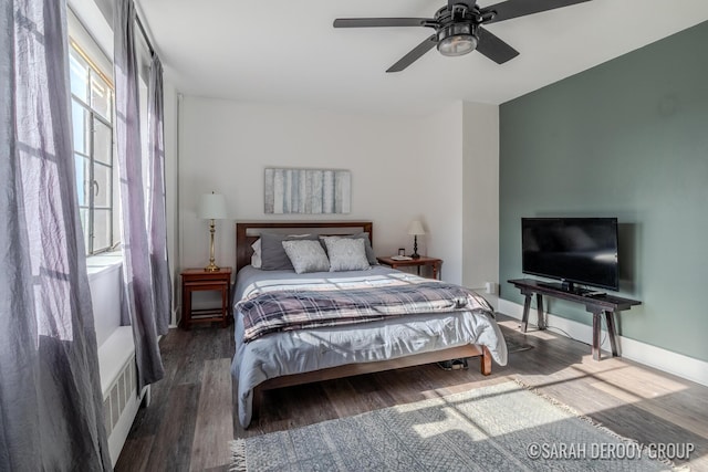 505 Cherry St SE Unit 512, Grand Rapids, MI 49503 - bedroom with wood finished floors, a ceiling fan, and baseboards