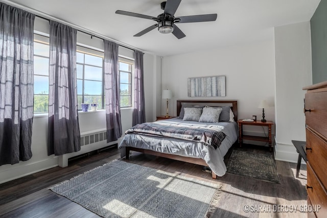 505 Cherry St SE Unit 512, Grand Rapids, MI 49503 - bedroom with wood finished floors, radiator, baseboards, and a ceiling fan