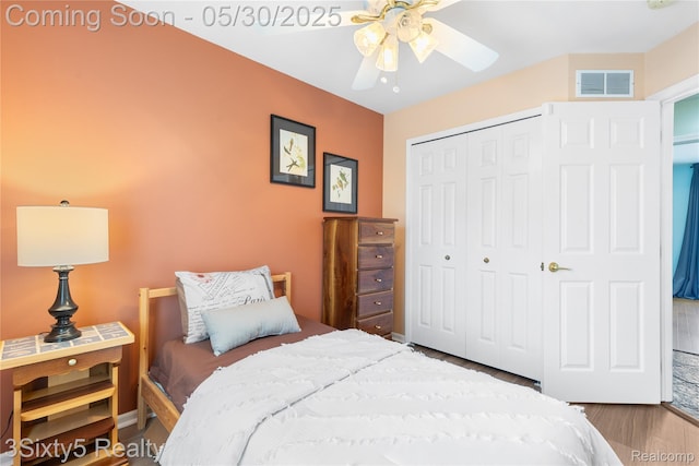 20791 Busenbark Ln, Brownstown, MI 48183 - bedroom featuring a closet, wood finished floors, ceiling fan, and baseboards