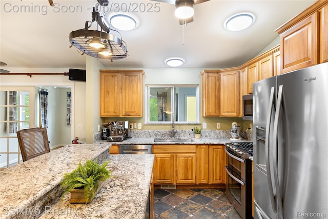 20791 Busenbark Ln, Brownstown, MI 48183 - kitchen with stainless steel appliances, a sink, ceiling fan, and light stone countertops