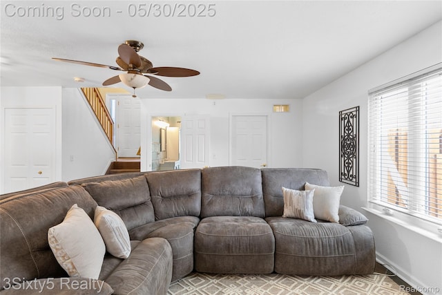 20791 Busenbark Ln, Brownstown, MI 48183 - living area with ceiling fan, baseboards, and stairs
