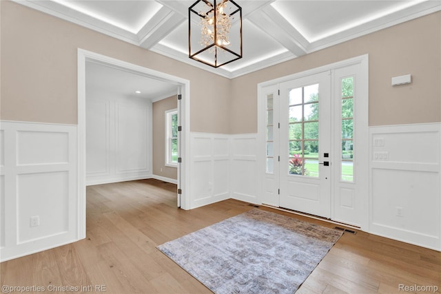 19138 Riverside Dr, Beverly Hills, MI 48025 - entrance foyer with coffered ceiling, a chandelier, a wainscoted wall, and light wood-style floors