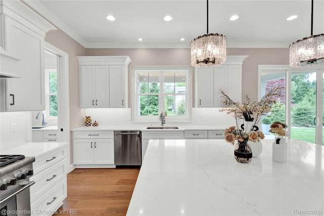 19138 Riverside Dr, Beverly Hills, MI 48025 - kitchen featuring a chandelier, stainless steel appliances, a sink, white cabinetry, and recessed lighting
