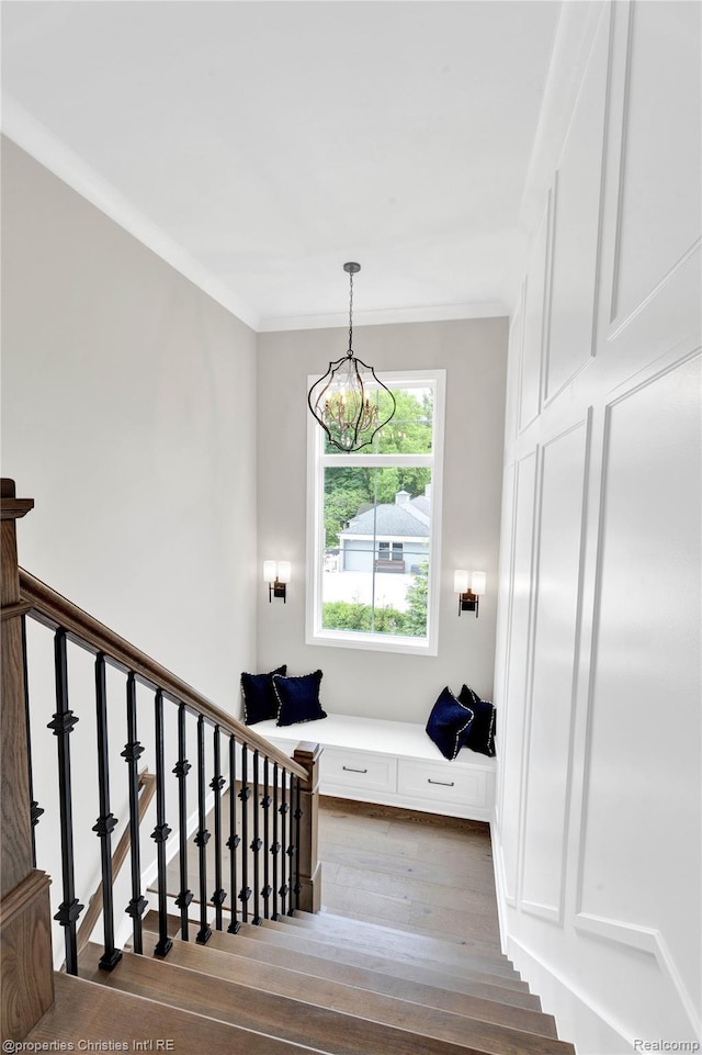 19138 Riverside Dr, Beverly Hills, MI 48025 - stairway featuring hardwood / wood-style floors, a chandelier, and crown molding