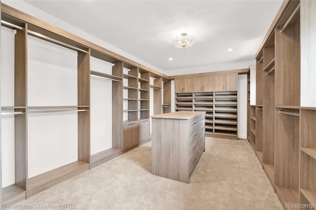 19138 Riverside Dr, Beverly Hills, MI 48025 - walk in closet featuring light colored carpet and a chandelier