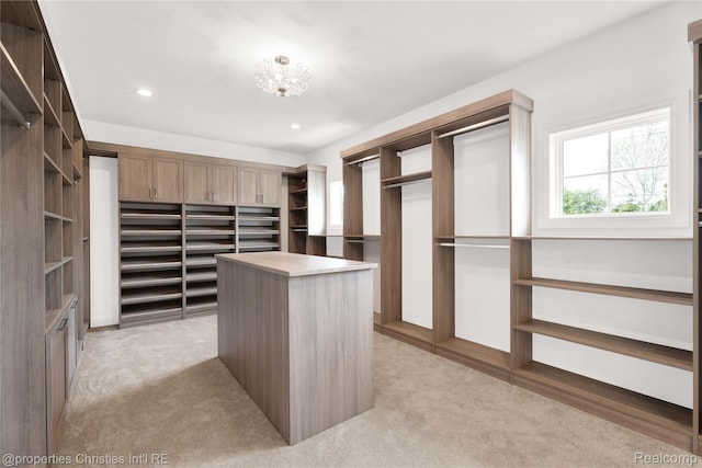 19138 Riverside Dr, Beverly Hills, MI 48025 - walk in closet with light colored carpet and a chandelier