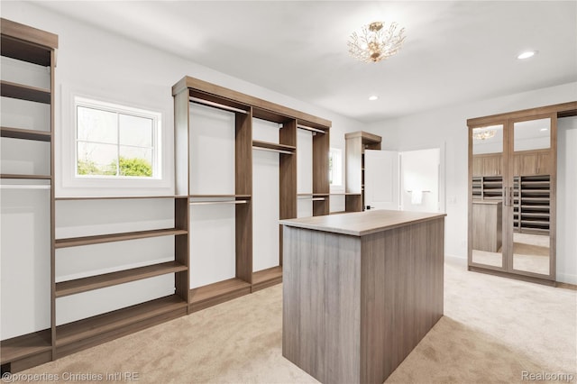 19138 Riverside Dr, Beverly Hills, MI 48025 - spacious closet featuring light colored carpet and a chandelier