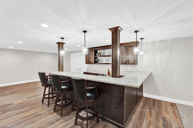 19138 Riverside Dr, Beverly Hills, MI 48025 - kitchen featuring open shelves, baseboards, a peninsula, dark brown cabinetry, and recessed lighting