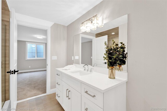 19138 Riverside Dr, Beverly Hills, MI 48025 - bathroom with vanity, baseboards, and a chandelier