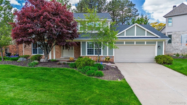 667 Heritage Ln, Rochester, MI 48309 - view of front of property with an attached garage, driveway, brick siding, and a front yard