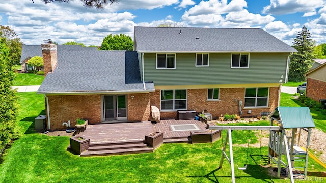 667 Heritage Ln, Rochester, MI 48309 - back of house featuring a chimney, a yard, and a deck