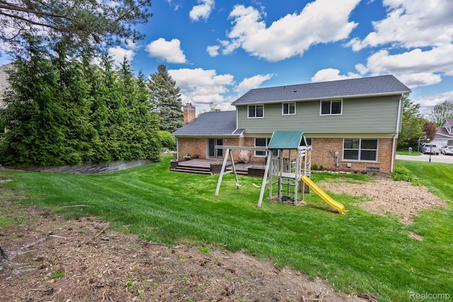 667 Heritage Ln, Rochester, MI 48309 - rear view of house featuring brick siding, a deck, a yard, a playground, and a chimney