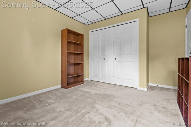 3430 Woodvalley Dr, Lapeer, MI 48446 - unfurnished bedroom featuring carpet floors, a drop ceiling, a closet, and baseboards