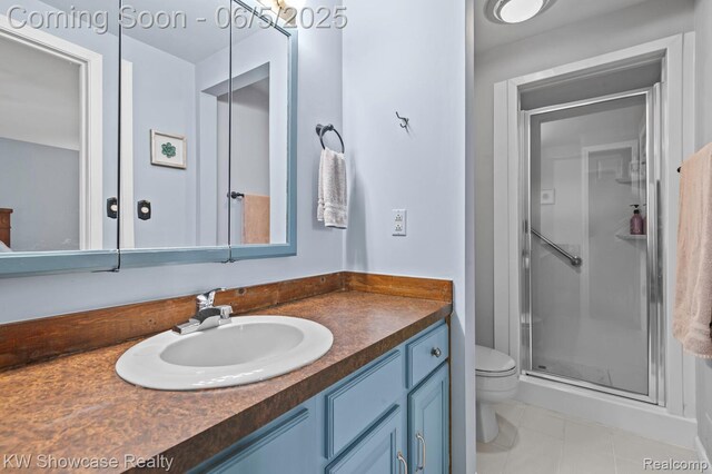 3430 Woodvalley Dr, Lapeer, MI 48446 - bathroom with toilet, vanity, a shower stall, and tile patterned floors