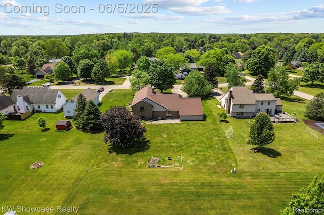 3430 Woodvalley Dr, Lapeer, MI 48446 - aerial view of residential area featuring a forest