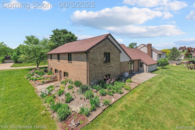 3430 Woodvalley Dr, Lapeer, MI 48446 - view of property exterior with brick siding and a yard