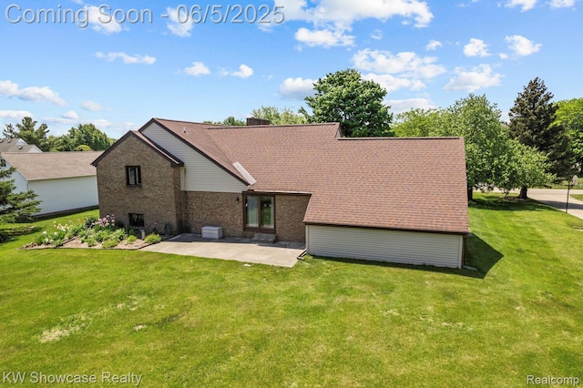 3430 Woodvalley Dr, Lapeer, MI 48446 - rear view of property featuring a patio, a lawn, and brick siding