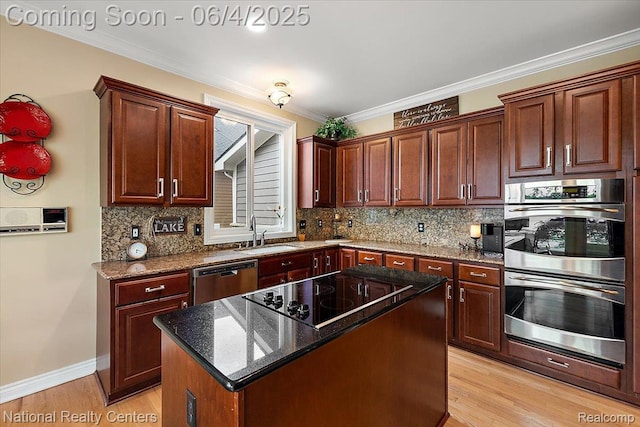 3448 Circle Dr, Commerce Twp, MI 48382 - kitchen featuring stainless steel appliances, a sink, a center island, backsplash, and light wood-style flooring