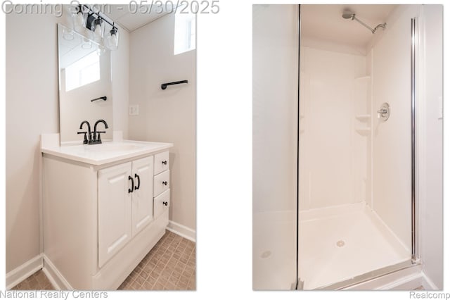 2029 Hubbell St, Dearborn, MI 48128 - full bathroom featuring a stall shower, vanity, and baseboards