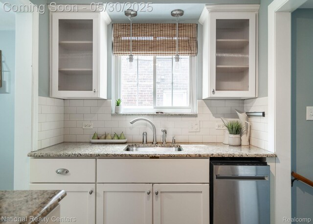 2029 Hubbell St, Dearborn, MI 48128 - kitchen featuring a sink, white cabinets, decorative backsplash, and glass insert cabinets