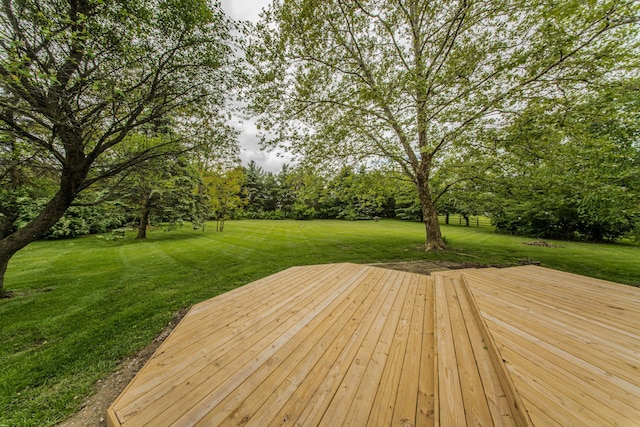 9117 Cambridge Dr, Saline, MI 48176 - deck featuring a lawn and view of scattered trees