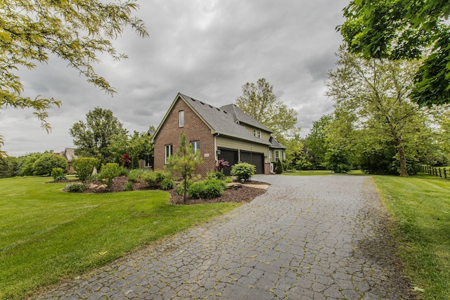9117 Cambridge Dr, Saline, MI 48176 - view of side of property with brick siding, a yard, decorative driveway, an attached garage, and a shingled roof